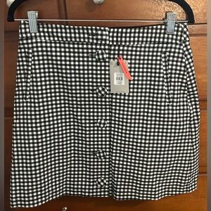 Plaid button up skirt, purchased in Australia. NWT!